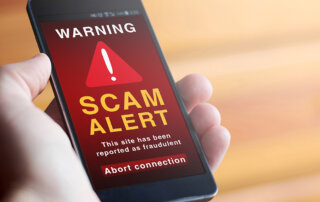 Scam alert displayed on a cell phone display.