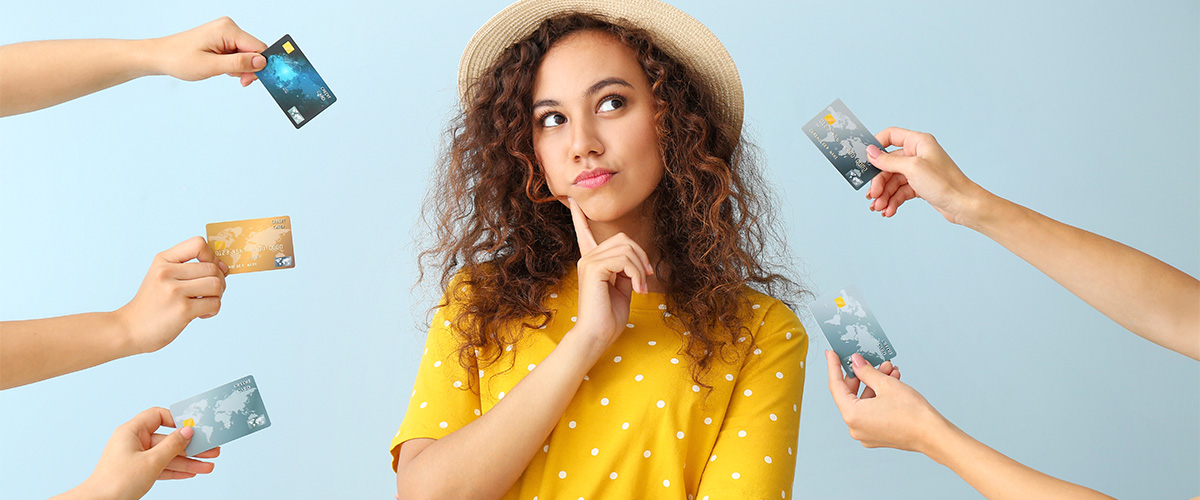 Woman thinking as she is being presented with credit card options.